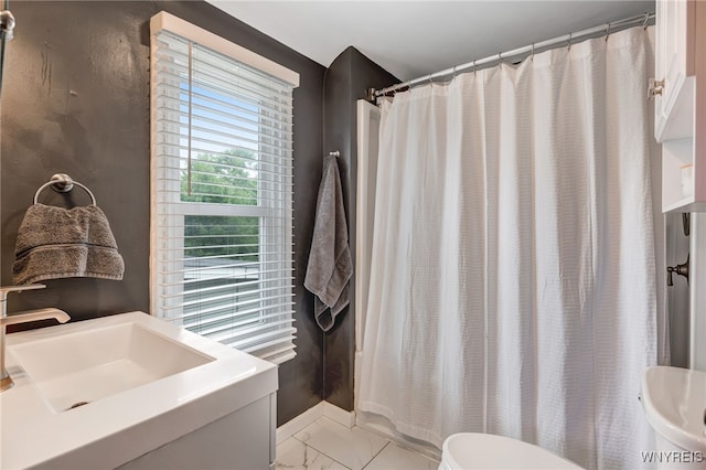 445 75th St, Niagara Falls, NY 14304 - full bathroom featuring marble finish floors, curtained shower, and vanity