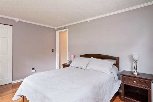 798 Hawthorne Pl, Webster, NY 14580 - bedroom with wood finished floors, ornamental molding, and a textured ceiling