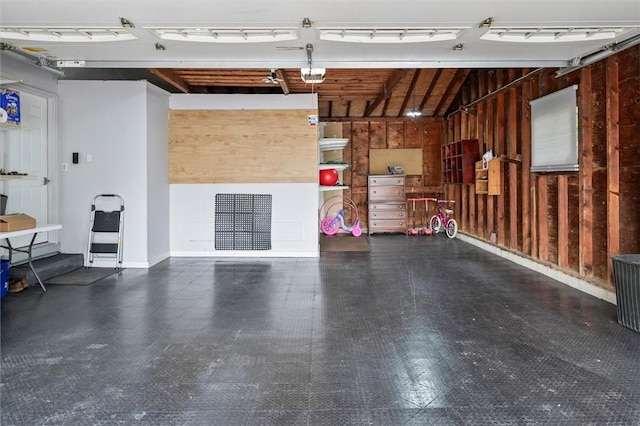 798 Hawthorne Pl, Webster, NY 14580 - garage featuring a garage door opener and wood walls