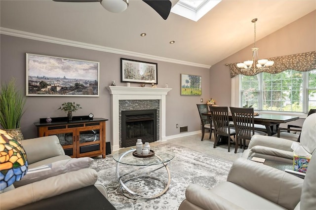798 Hawthorne Pl, Webster, NY 14580 - tiled living room featuring crown molding, a chandelier, a tiled fireplace, a skylight, and vaulted ceiling
