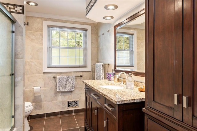 798 Hawthorne Pl, Webster, NY 14580 - full bathroom featuring tile walls, vanity, tile patterned flooring, a shower stall, and ornamental molding