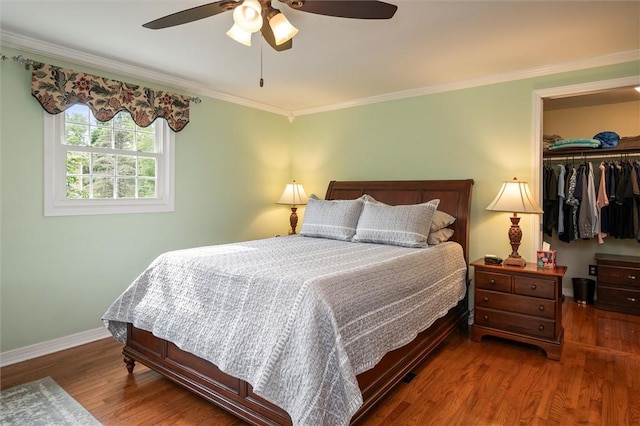 798 Hawthorne Pl, Webster, NY 14580 - bedroom featuring wood finished floors, crown molding, ceiling fan, and a walk in closet