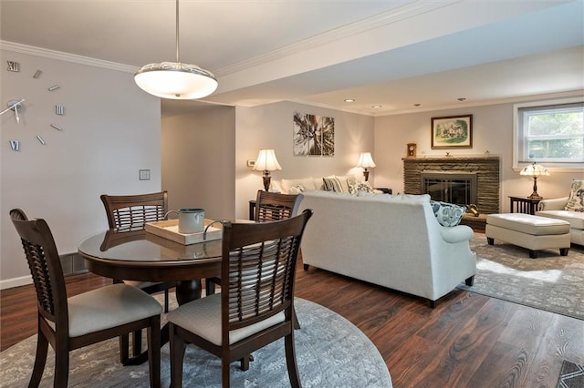 798 Hawthorne Pl, Webster, NY 14580 - dining space with dark wood-type flooring, ornamental molding, and a fireplace
