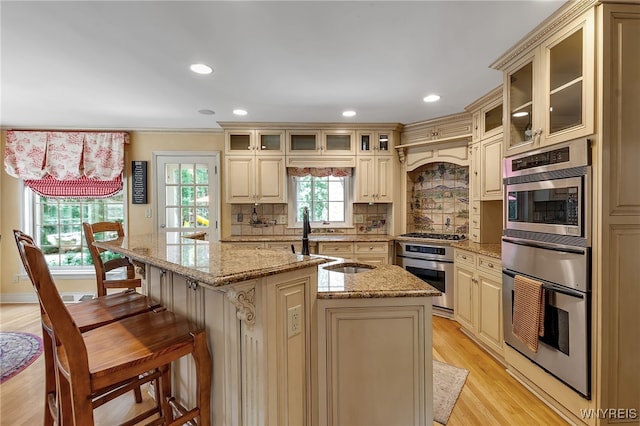29 Cherry Tree Ln, Orchard Park, NY 14127 - kitchen with stainless steel appliances, cream cabinetry, a warming drawer, backsplash, and recessed lighting