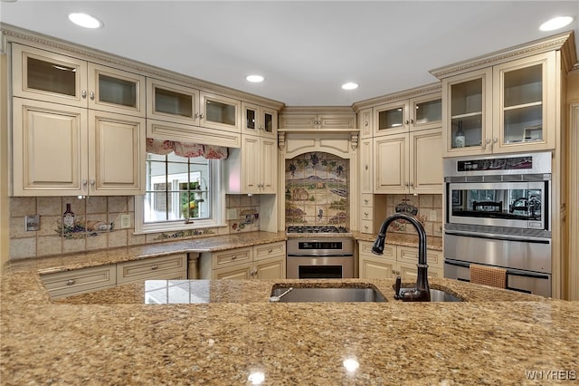 29 Cherry Tree Ln, Orchard Park, NY 14127 - kitchen featuring cream cabinets, stainless steel appliances, light stone counters, a warming drawer, and backsplash