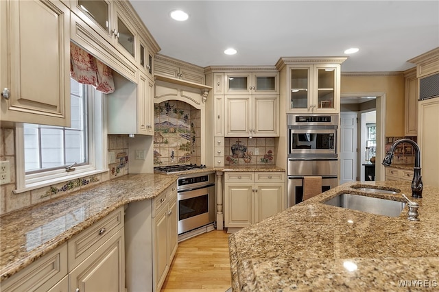 29 Cherry Tree Ln, Orchard Park, NY 14127 - kitchen with cream cabinets, plenty of natural light, stainless steel gas cooktop, decorative backsplash, and recessed lighting
