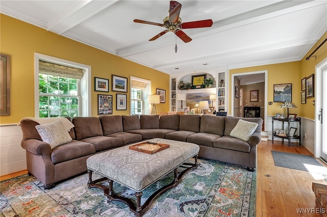 29 Cherry Tree Ln, Orchard Park, NY 14127 - living area with beam ceiling, light wood-type flooring, ceiling fan, wainscoting, and built in shelves