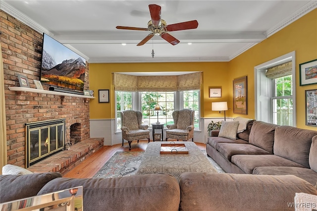 29 Cherry Tree Ln, Orchard Park, NY 14127 - living room with wood finished floors, beamed ceiling, a ceiling fan, a fireplace, and ornamental molding