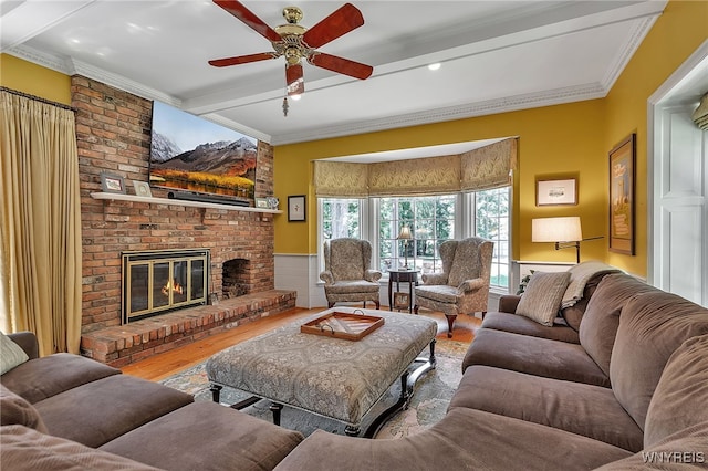 29 Cherry Tree Ln, Orchard Park, NY 14127 - living area featuring beam ceiling, wood finished floors, a fireplace, ceiling fan, and crown molding