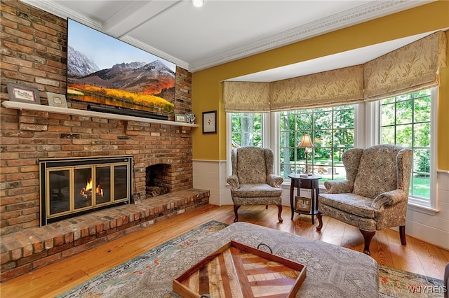 29 Cherry Tree Ln, Orchard Park, NY 14127 - living area featuring hardwood / wood-style flooring, a fireplace, healthy amount of natural light, and ornamental molding