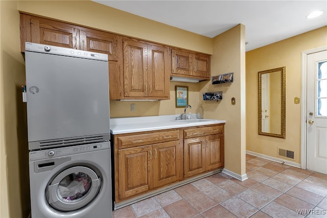 29 Cherry Tree Ln, Orchard Park, NY 14127 - washroom featuring stacked washer and clothes dryer, cabinet space, and recessed lighting