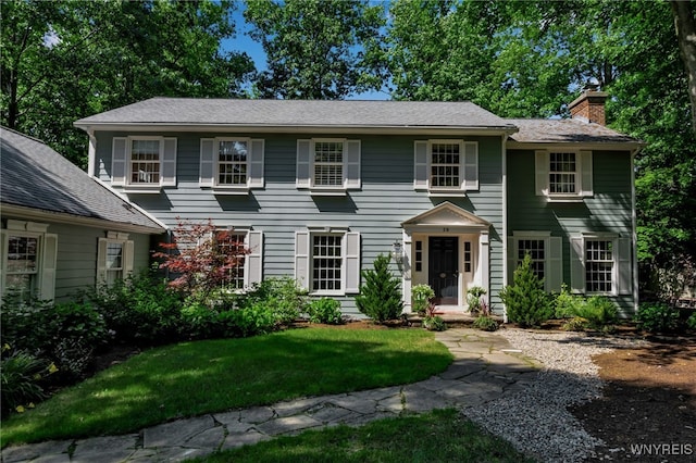 29 Cherry Tree Ln, Orchard Park, NY 14127 - colonial home featuring a chimney and a front yard