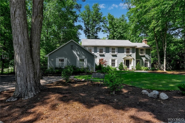 29 Cherry Tree Ln, Orchard Park, NY 14127 - colonial house with a chimney and a front yard