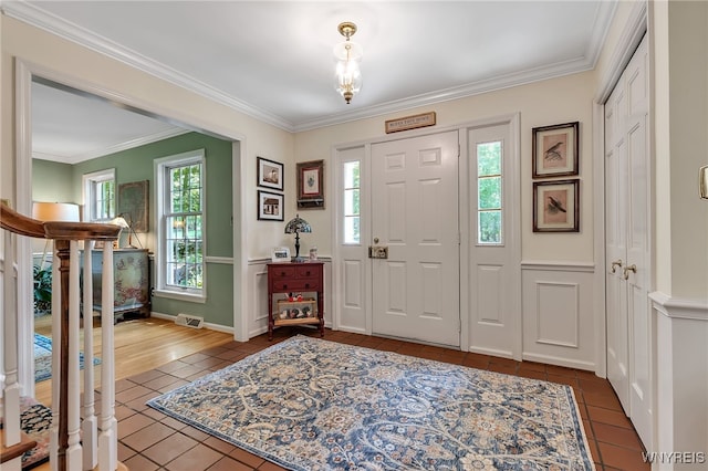 29 Cherry Tree Ln, Orchard Park, NY 14127 - foyer entrance featuring tile patterned floors, ornamental molding, and stairs