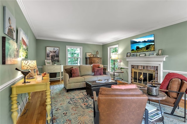 29 Cherry Tree Ln, Orchard Park, NY 14127 - living area with wood finished floors, ornamental molding, and a brick fireplace