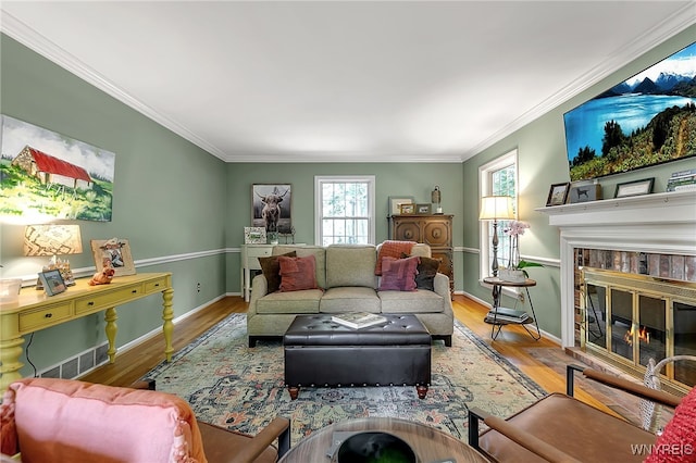 29 Cherry Tree Ln, Orchard Park, NY 14127 - living area featuring wood finished floors, ornamental molding, and a fireplace