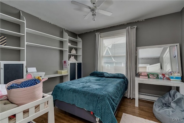 210 N James St, Wilna, NY 13619 - bedroom featuring wood finished floors, a baseboard heating unit, and ceiling fan