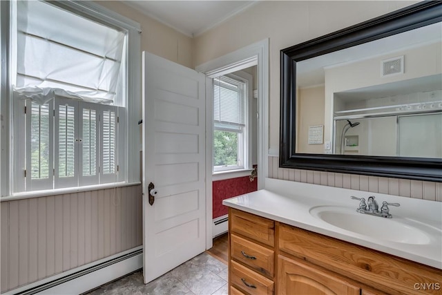 210 N James St, Wilna, NY 13619 - bathroom with baseboard heating, vanity, a shower with shower door, and crown molding