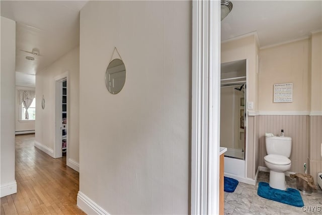 210 N James St, Wilna, NY 13619 - corridor with light wood-type flooring and a baseboard heating unit