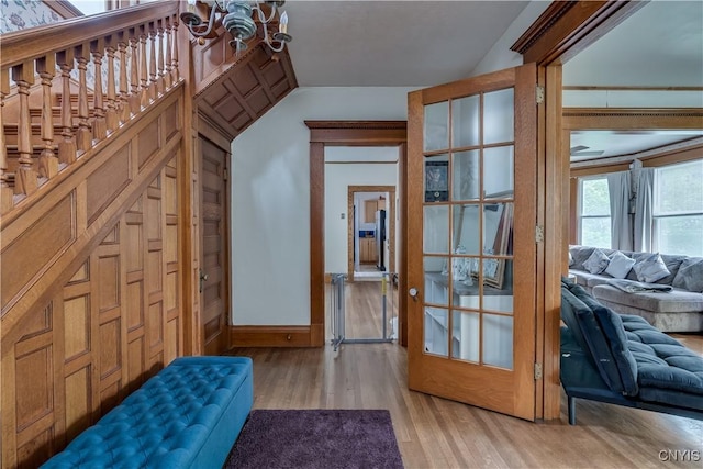210 N James St, Wilna, NY 13619 - entrance foyer with a chandelier, light wood-style flooring, and vaulted ceiling