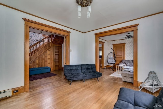 210 N James St, Wilna, NY 13619 - living area with light wood-type flooring, ornamental molding, a baseboard heating unit, stairway, and ceiling fan