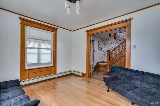 210 N James St, Wilna, NY 13619 - living room with stairs, crown molding, light wood-type flooring, and baseboard heating