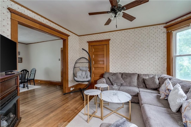 210 N James St, Wilna, NY 13619 - living room featuring ornamental molding, light wood-type flooring, wallpapered walls, and ceiling fan