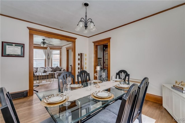 210 N James St, Wilna, NY 13619 - dining room with ornamental molding, light wood finished floors, a chandelier, and a ceiling fan