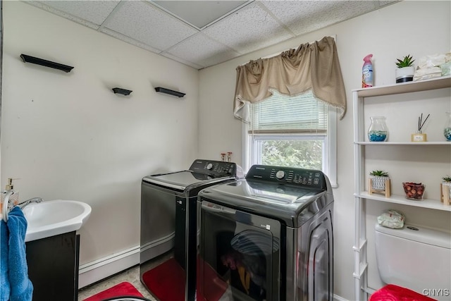 210 N James St, Wilna, NY 13619 - laundry room with baseboard heating and washing machine and dryer