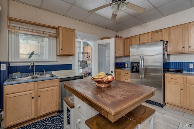 210 N James St, Wilna, NY 13619 - kitchen with appliances with stainless steel finishes, a drop ceiling, ceiling fan, wooden counters, and light brown cabinets