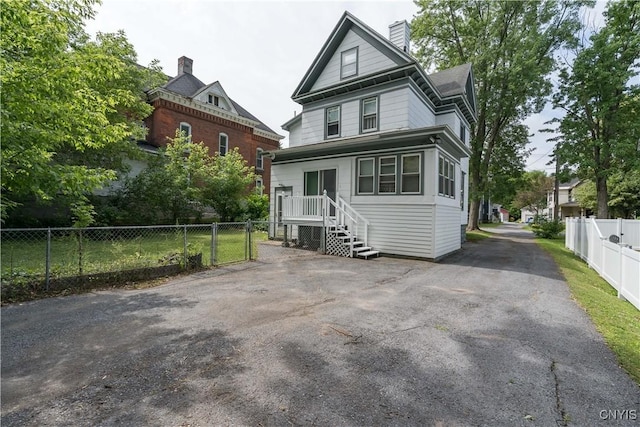 210 N James St, Wilna, NY 13619 - view of front of home featuring a chimney