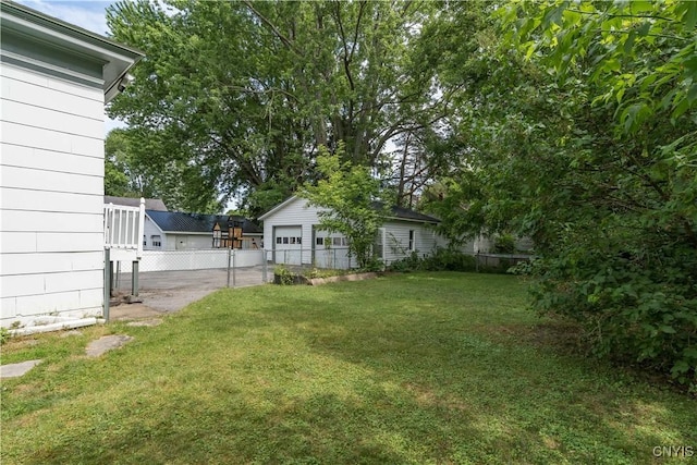 210 N James St, Wilna, NY 13619 - view of yard featuring a detached garage and an outbuilding