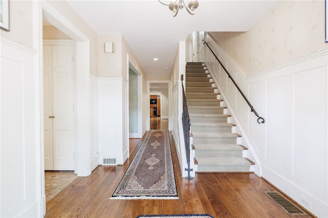 8 Oak Ln, Brighton, NY 14610 - entrance foyer with a decorative wall, stairway, wood finished floors, wainscoting, and recessed lighting