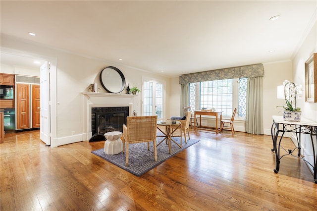8 Oak Ln, Brighton, NY 14610 - living area featuring crown molding, a fireplace with flush hearth, light wood-style floors, and recessed lighting