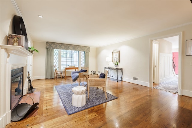 8 Oak Ln, Brighton, NY 14610 - living area featuring crown molding, wood finished floors, a high end fireplace, and recessed lighting