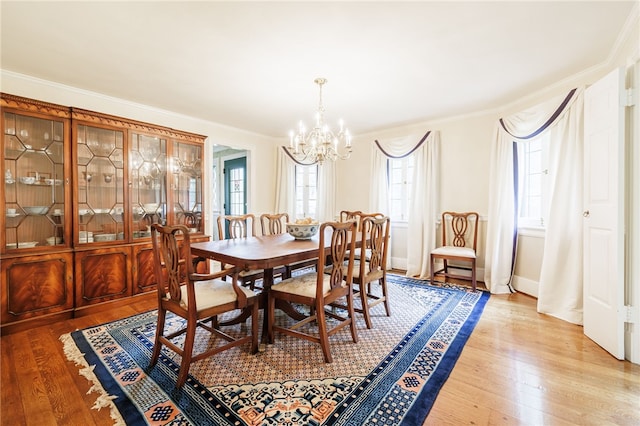 8 Oak Ln, Brighton, NY 14610 - dining space with a chandelier, light wood finished floors, and ornamental molding