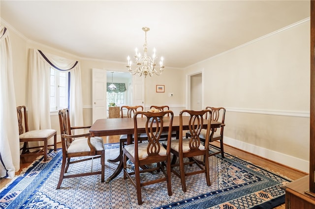 8 Oak Ln, Brighton, NY 14610 - dining area with a chandelier, light wood-style floors, and ornamental molding