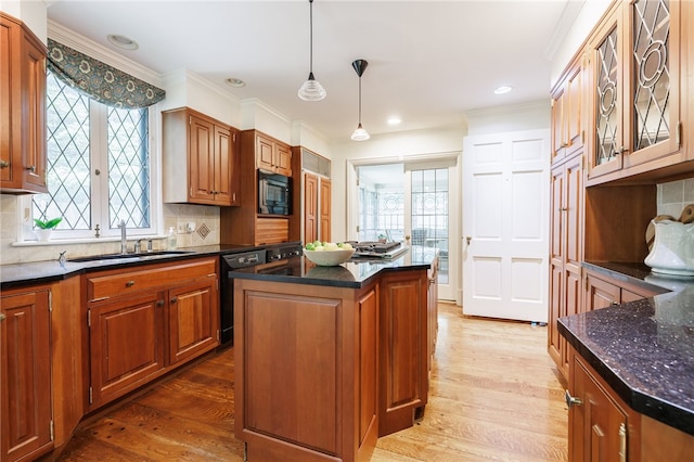 8 Oak Ln, Brighton, NY 14610 - kitchen with black appliances, wood finished floors, ornamental molding, decorative backsplash, and plenty of natural light