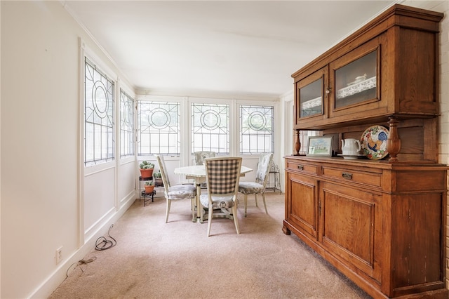 8 Oak Ln, Brighton, NY 14610 - dining area featuring light carpet and crown molding