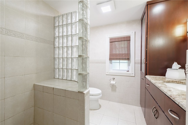 8 Oak Ln, Brighton, NY 14610 - full bathroom with tile walls, tile patterned flooring, vanity, and walk in shower
