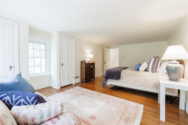 8 Oak Ln, Brighton, NY 14610 - bedroom featuring wood finished floors and baseboards