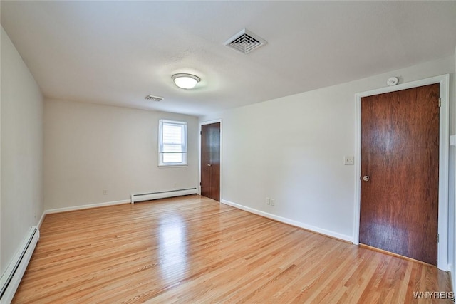 46 Macarthur Dr, Amherst, NY 14221 - unfurnished room featuring a baseboard radiator, light wood finished floors, and a smoke detector