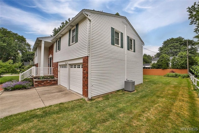 46 Macarthur Dr, Amherst, NY 14221 - view of side of home featuring an attached garage and concrete driveway