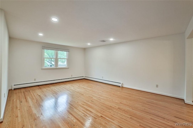 46 Macarthur Dr, Amherst, NY 14221 - spare room with a baseboard heating unit, wood finished floors, and recessed lighting