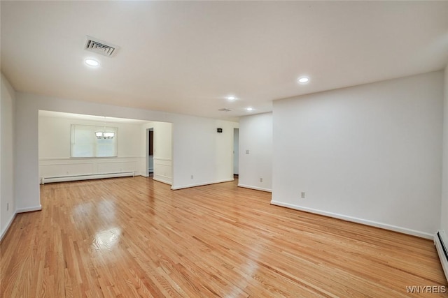 46 Macarthur Dr, Amherst, NY 14221 - unfurnished room with baseboard heating, light wood finished floors, a chandelier, and recessed lighting