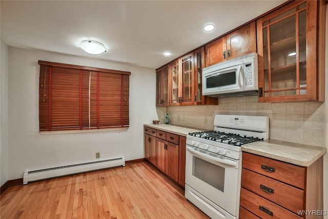 46 Macarthur Dr, Amherst, NY 14221 - kitchen featuring white appliances, a baseboard heating unit, light countertops, decorative backsplash, and recessed lighting