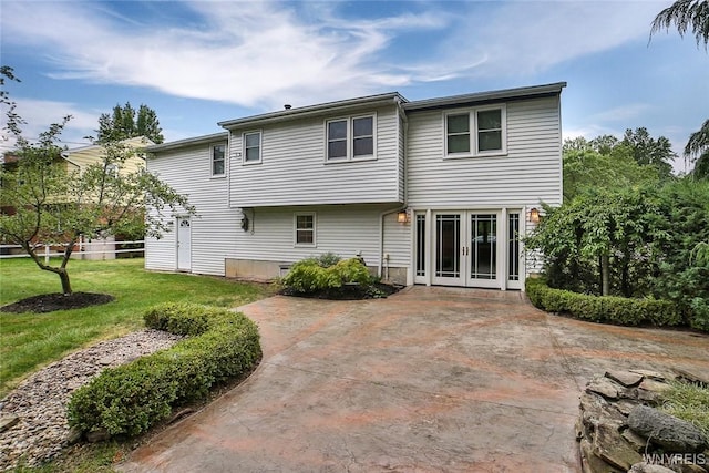 46 Macarthur Dr, Amherst, NY 14221 - rear view of house with french doors, a yard, and a patio