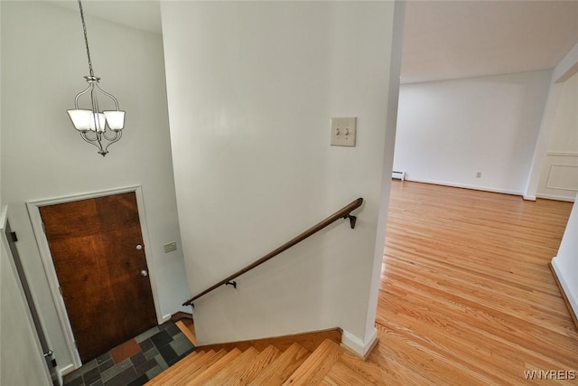 46 Macarthur Dr, Amherst, NY 14221 - stairway featuring baseboard heating and wood finished floors