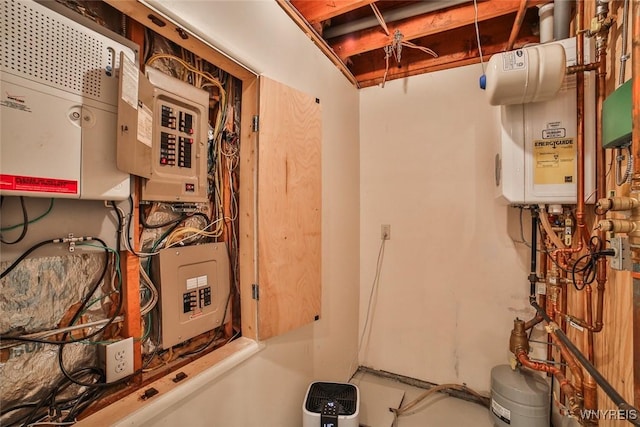 46 Macarthur Dr, Amherst, NY 14221 - utility room featuring electric panel and tankless water heater