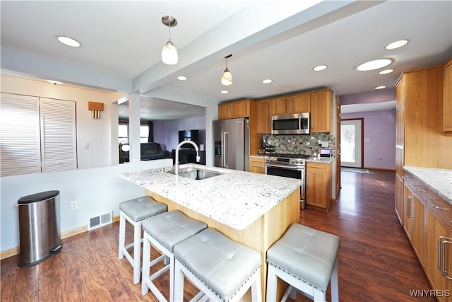 120 Cloverside Ct, West Seneca, NY 14224 - kitchen with stainless steel appliances, dark wood-type flooring, light stone counters, recessed lighting, and a breakfast bar